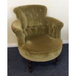 A green upholstered button back armchair. Est. £30