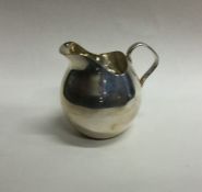 A fancy baluster shaped silver cream jug. Approx.