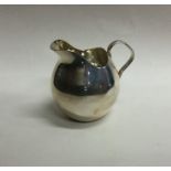 A fancy baluster shaped silver cream jug. Approx.