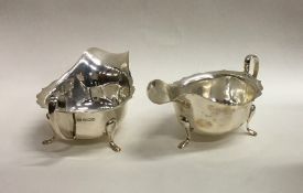 Two silver sauce boats with card cut rims. Sheffie