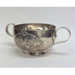 An Edwardian silver two handled cup mounted with c
