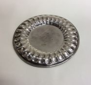 A Georgian circular silver waiter with fluted bord