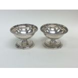 A pair of heavy circular Georgian silver salts wit