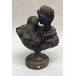 A heavy bronze model of a romantic couple in kissi