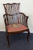 An Edwardian mahogany chair with tapestry seat. Es