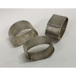 Three silver engine turned napkin rings. Approx. 6