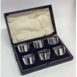 A cased set of six plain silver napkin rings. Birm