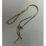A 9 carat tassel link necklace. Approx. 14.7 grams