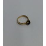 An 18 carat gold tanzanite and diamond ring. Appro