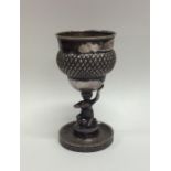 A small Continental silver trophy cup of textured