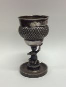 A small Continental silver trophy cup of textured