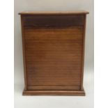 A good quality oak miniature tambour front bookcas