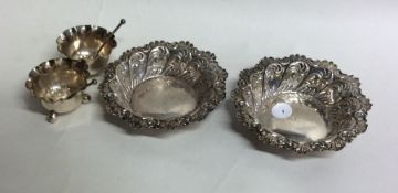 A pair of embossed silver bonbon dishes together w