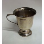 An Edwardian silver christening cup on spreading b