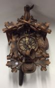 An old cuckoo clock of typical design complete wit