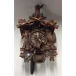 An old cuckoo clock of typical design complete wit