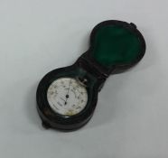 A cased silver mounted pocket barometer. By John B