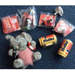 A quantity of Coca-Cola and Pepsi promotional toys