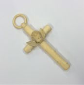 A large carved ivory cross with loop top. Approx.