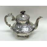 An attractive Victorian engraved silver teapot on