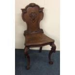 A good hall chair with carved decoration. Est. £50