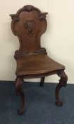 A good hall chair with carved decoration. Est. £50