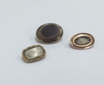 A group of three Antique gold mourning brooches wi