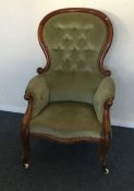 A Victorian button back nursing chair with shaped