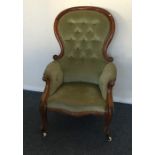 A Victorian button back nursing chair with shaped