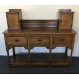 An unusual three drawer sideboard on stretcher bas