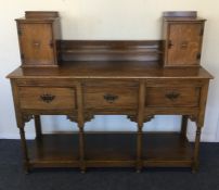 An unusual three drawer sideboard on stretcher bas