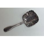 A Georgian silver fiddle pattern caddy spoon with