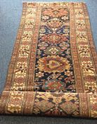 An Antique long runner decorated with bright colou