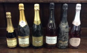 Six various bottles of sparkling wines as follows: