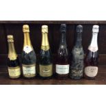 Six various bottles of sparkling wines as follows: