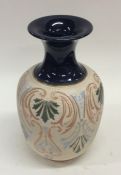 LANGLEY: A baluster shaped vase in cream with blue