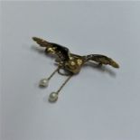 A French eagle brooch with outstretched wings and