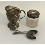 A silver cream jug together with a silver mounted