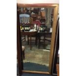 A large gilt framed wall mirror with moulded frame