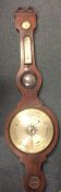 A mahogany banjo barometer with silvered dial. Est