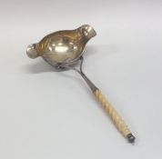 An unusual Continental silver double lipped ladle
