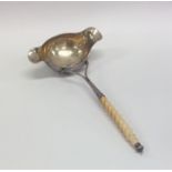 An unusual Continental silver double lipped ladle