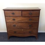 A Georgian mahogany chest of five drawers with bra