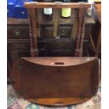 A mahogany mounted butlers' tray on stand on turne