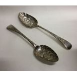 A matched pair of Georgian silver berry spoons wit