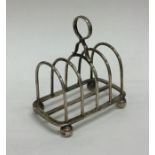 A heavy silver five bar toast rack / smartphone do