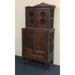 An unusual Gothic style side cabinet in two sectio