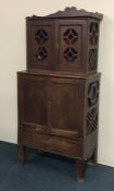 An unusual Gothic style side cabinet in two sectio