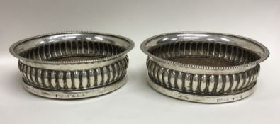 A good pair of Georgian silver half fluted coaster