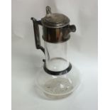 A Victorian silver mounted hinged top lemonade jug